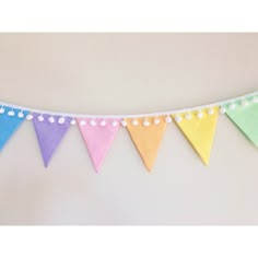 a multicolored bunting banner hanging on a wall