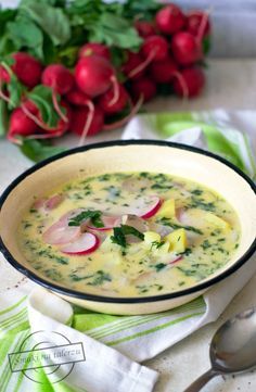 a bowl of soup with radishes on the side