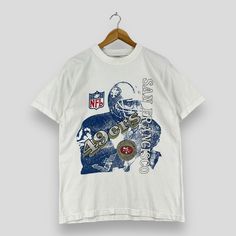 a white t - shirt with a football player on it and the words, new york giants