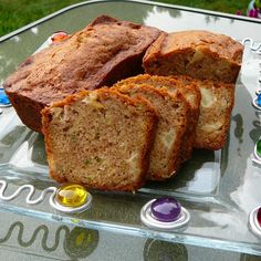 sliced loaf of banana bread sitting on top of a glass tray