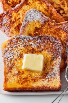 french toast with butter and powdered sugar on top