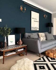 a living room with two couches, a coffee table and a rug on the floor