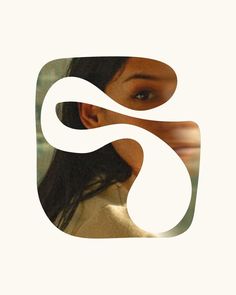 a woman's face is shown with the letter s in the middle of it