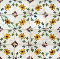 a tile with yellow flowers on it