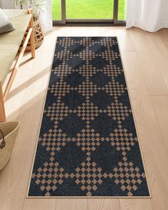 a large rug in the middle of a living room with a chair and window behind it