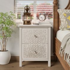 a bedroom scene with focus on the nightstand and bed side table in the foreground