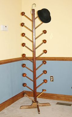 a hat rack in the corner of a room