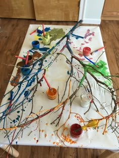 the table is covered with paint and branches