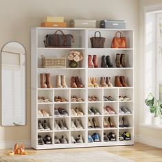 a white shelf filled with lots of shoes next to a mirror and rug in a room