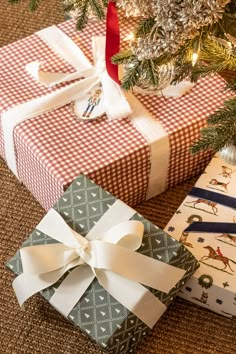 two wrapped presents under a christmas tree