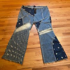 an old pair of jeans with holes and patches on them