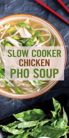 slow cooker chicken pho soup in a bowl with chopsticks on the side