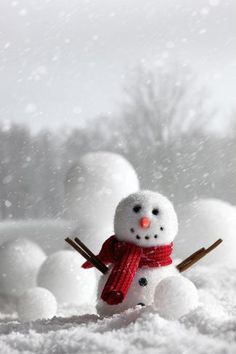 a snowman is standing in the snow