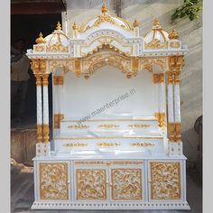 an ornate white and gold shrine