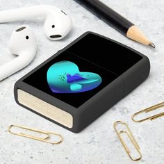 an apple airpods sitting on top of a table next to ear buds