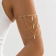 A beautifully bohemian upper arm cuff with gorgeous gold draping chains. The cuff opens and closes for adjustment in size. See our range of body jewellery here https://www.etsy.com/uk/shop/IndisaJewellery?ref=shop_sugg_market&section_id=15529913 See our store here  https://www.etsy.com/uk/shop/IndisaJewellery Indisa jewellery will be lovingly hand wrapped and packaged within our letterbox and eco-friendly signature boxes for that extra special unboxing experience. Sending a gift? Personalise you Body Jewelry Gold, Upper Arm Cuff, Upper Arm Cuffs, Beach Jewellery, Arm Bracelet, Arm Bracelets, Unboxing Experience, Punk Vintage, Open Bangle