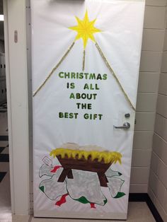 a door decorated with christmas decorations and the words, christmas is all about the best gift