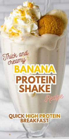 banana protein shake recipe in a glass with whipped cream and orange zest on top