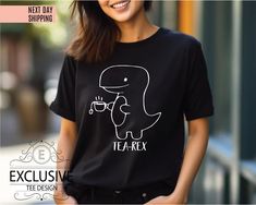 This Enchanting Tea-Rex Shirt is sure to be an ideal present! Every one of our tees is crafted using top-notch materials and boasts an incredibly plush and snug feel! A distinctive token that will endure for generations! ----- How To Order ----- 1-) Please, check and review all the photos. 2-) Choose your t-shirt size and color. *Different styles of shirts may have different shades of same color choice due to different manufacturer brands. *For this reason, we recommend you to match shirts from Tea Rex, Dino Tee, T Rex Humor, Dino Shirt, Dinosaur Shirt, Tea Lovers Gift, Cute Dinosaur, Tea Lover, Unisex Shirts