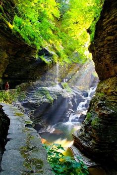 there is a waterfall in the middle of this canyon