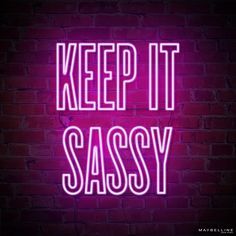 a neon sign that says keep it sassy