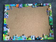 a photo frame made out of legos on the floor