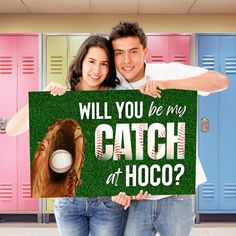 a man and woman holding up a sign that says, will you be my catch at hoco?