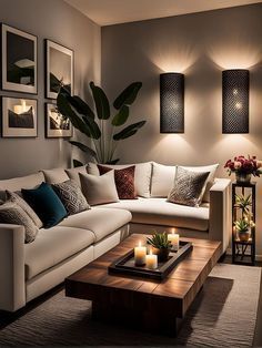 a living room filled with lots of furniture next to a wall mounted plant and candles