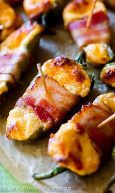 bacon wrapped in cheese and other toppings on skewers