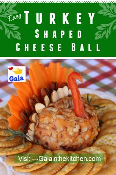 a turkey shaped cheese ball on a plate with crackers