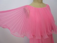 Vintage 1970s dance caplet dress. Beautiful made from sheer flowing lightweight poly or nylon. Permanently pleated with wired convoluting hems. High empire waist on full taffeta slip lining. Nylon zipper and hook and eye to back closure.  Commercially made but no labels. Reminds me of the ballroom dancers on the Lawrence Welk Show. Very good vintage condition. Previous owner sewed small darts in front and back armhole. As seen in photo, fits perfectly on dress form. No issues. See photos, Unmark The Lawrence Welk Show, Lawrence Welk, Capelet Dress, Ballroom Dancer, Hip Openers, Dress Form, Dress Beautiful, Dress Clothes For Women, Vintage 1970s