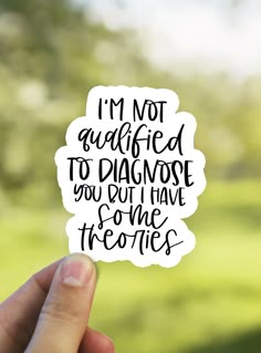 someone holding up a sticker that says i'm not afraid to diagnose you