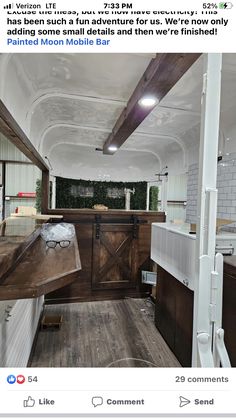 the interior of a mobile home with wood flooring and white paint on the walls