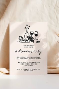 a dinner party card with wine glasses and flowers on it next to a bed sheet