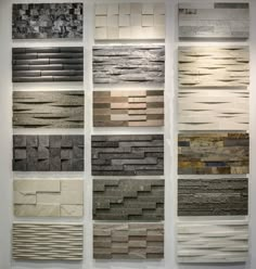 several different types of tile on display in a room with white walls and flooring