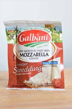 a bag of mozzarella cheese sitting on top of a wooden table