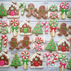 an image of gingerbread cookies with christmas decorations on them and candy canes in the middle