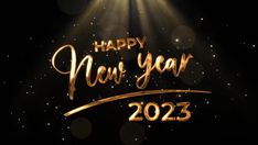 a happy new year greeting card with gold lettering and spotlights on a black background