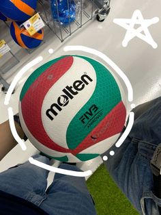 a person is holding a large ball in their hand with the word molten on it