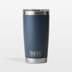 the yeti tumbler is shown in blue and has an emblem on the side