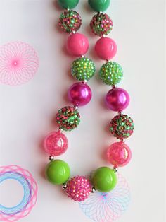 "-  Different shades of pink and green color chunky beads with silver spacers.  So pretty. -  Your little girl or toddler will look like a Princess in this beautiful, fun, Chunky Bubblegum Necklace. -  This necklace would be the perfect dazzling addition for your little Princess outfit to wear for any special occasion. -  Necklace length 17\" 20mm beads Materials:  acrylic beads, resin beads, stainless steel bead wire, crimp tubes, stainless steel clasps **Custom Orders Are Welcome** Ready to sh Toddler Necklace, Toddler Jewelry, Princess Outfit, Jewelry Chunky, Bead Wire, Bubblegum Necklace, Different Shades Of Pink, Chunky Beads, Princess Outfits