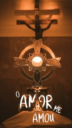 an image of a cross and the words omr me amou above it