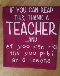 a red sign that says if you can read this, thank a teacher