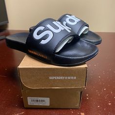 Superdry Mf3108st Classic Pool Slide Sandals Sz S Brand: Superdry Department: Men Size: Small Color: Black, White Type: Sandals Style: Slide Style Code: Mf3108st Pattern: Solid Theme: Classic Closure: Slip On Features: Comfort, Lightweight Occasion: Casual Seasons: All Seasons Condition: New With Box I Offer Discounts For All Return Customers. - Jvs Black Waterproof Slides For Summer, Black Waterproof Slides For The Beach, Black Flat Slides For Outdoor, Black Outdoor Sandals With Branded Insole, Black Waterproof Slides For Outdoor, Black Waterproof Open Toe Sandals, Black Open Toe Waterproof Sandals, Outdoor Black Sandals With Branded Insole, Black Waterproof Synthetic Sport Sandals