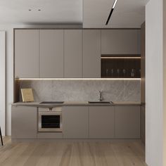 a modern kitchen with marble counter tops and wooden floors