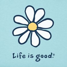 a pink shirt with a white flower on the front and words life is good written in blue