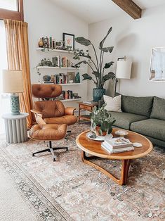 the living room is clean and ready to be used as an office or study space