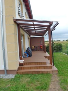 a house with a covered porch and stairs