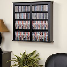 an entertainment center with several dvd's on the shelves