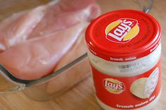 two pieces of chicken in a glass container next to an open can of frozen meat